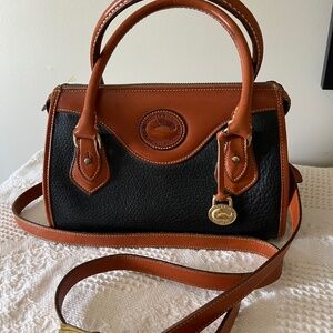 Classic Dooney and Bourke Satchel Blk pebble leather w/tan, crossbody strap